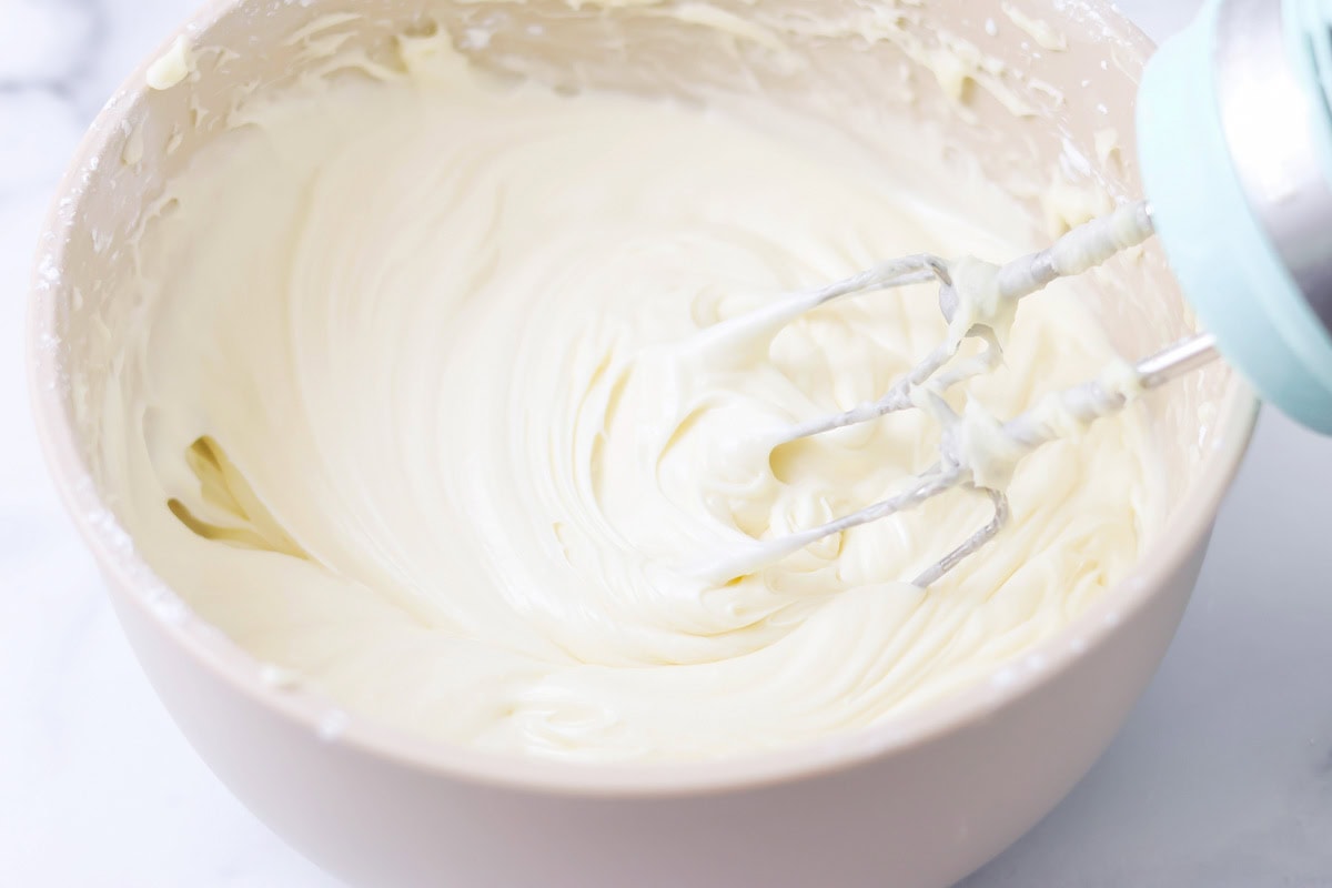 Whipping frosting in a bowl.