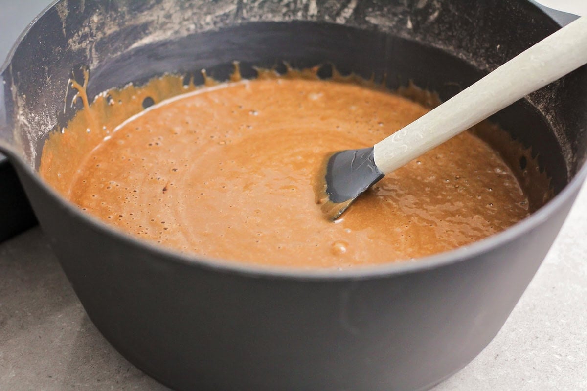 Cake batter in a grey bowl.