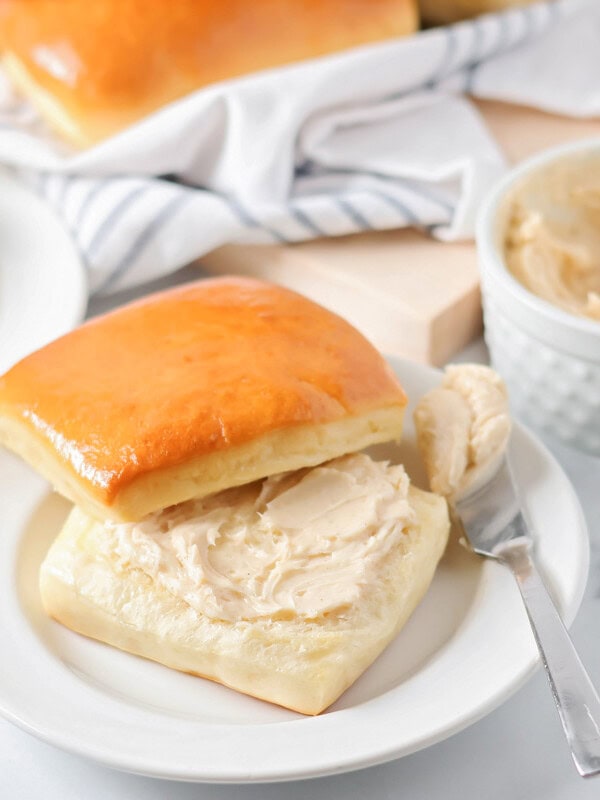 Homemade cinnamon butter spread on a warm roll.