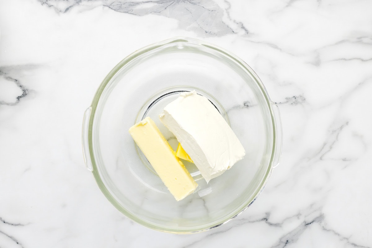 Cream cheese and butter in glass bowl.