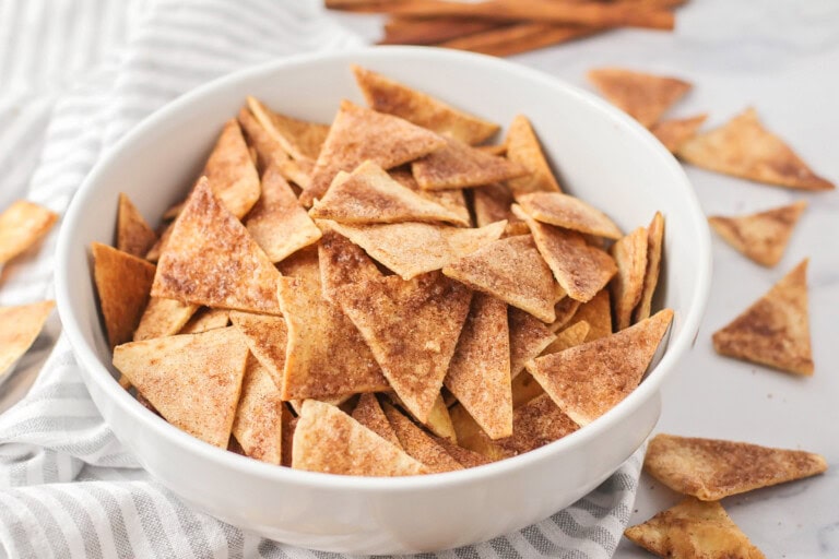 Homemade cinnamon tortilla chips recipe in white bowl.