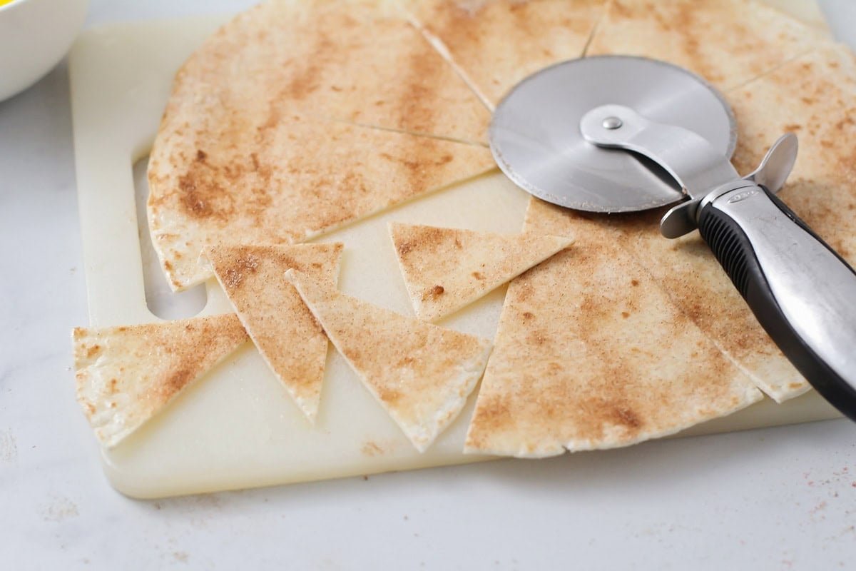 Tortillas cut into triangles for cinnamon tortilla chips.