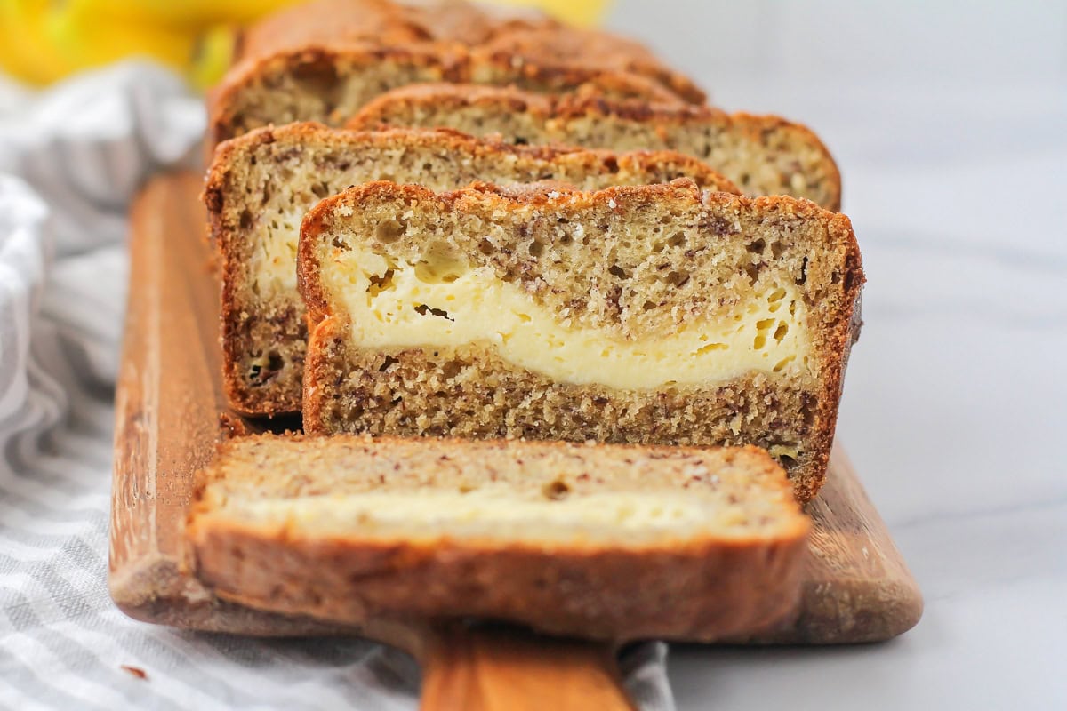 Cream cheese banana bread in the center of sliced bread.