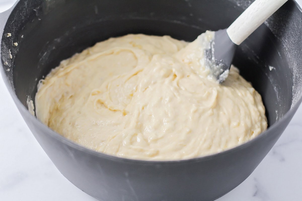Bread batter in a gray bowl.