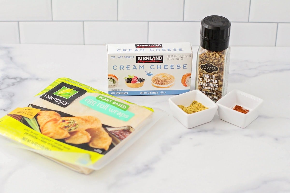 Ingredients for cream cheese wontons on a kitchen counter.