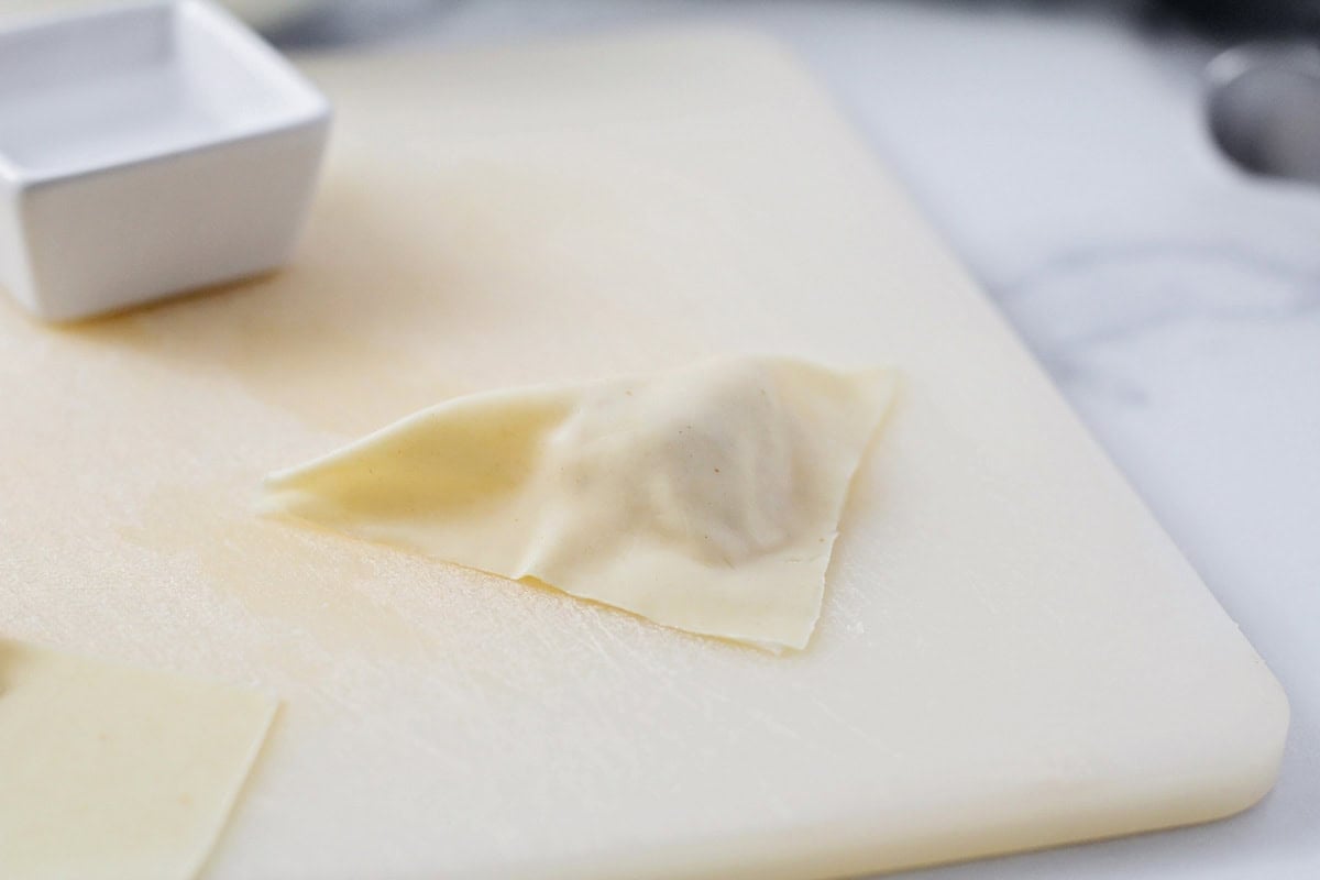 Filled wonton ready to be fried.