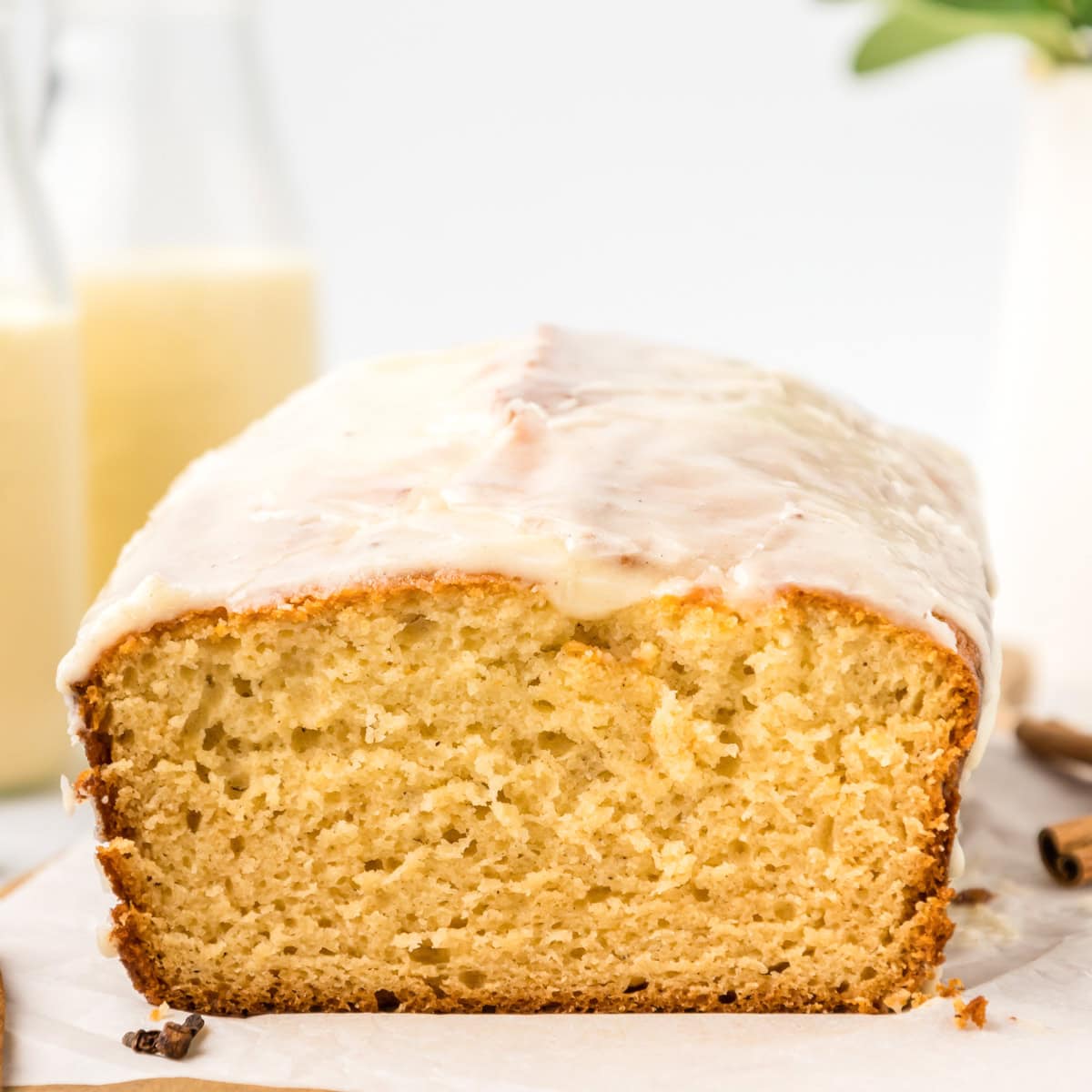 Slices of eggnog bread with glaze on top.