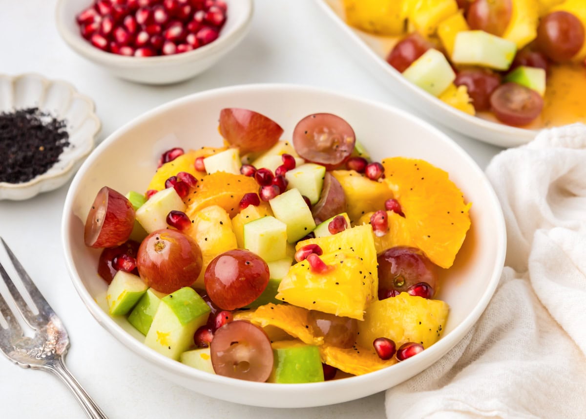 Fall fruit salad served on a white plate.