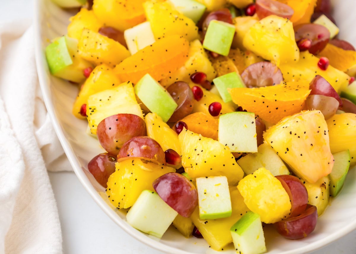 Fall fruit salad served on a white plate.