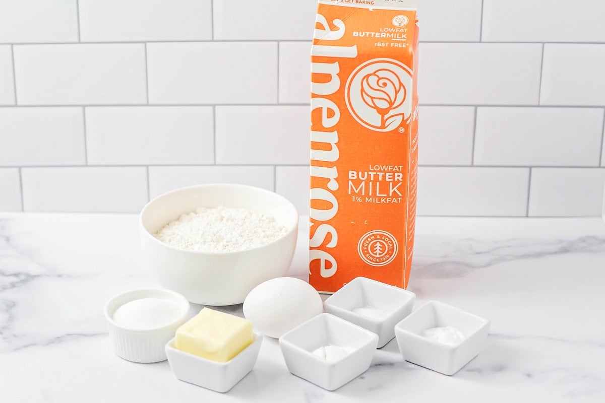 Buttermilk, flour, and other ingredients on a kitchen counter.