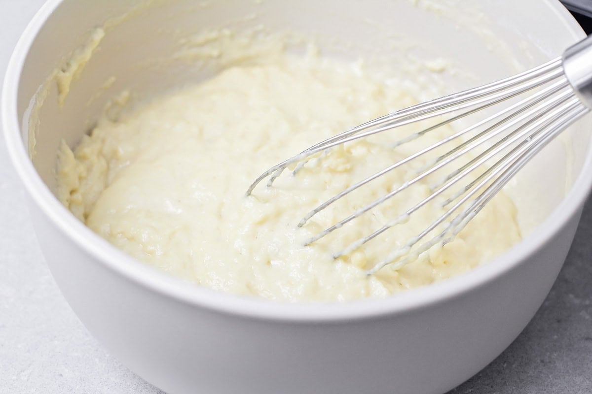 Whisking batter in a bowl.