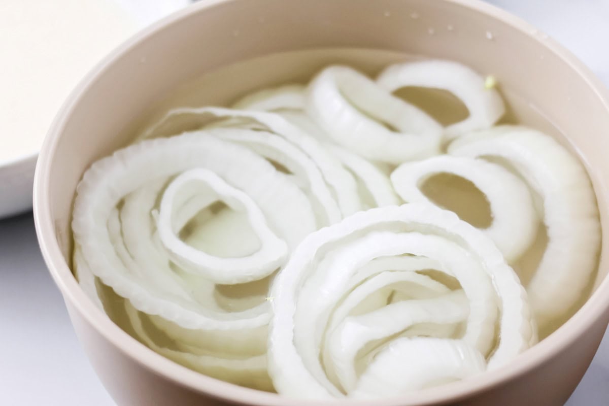 Sliced onions soaking in ice water.