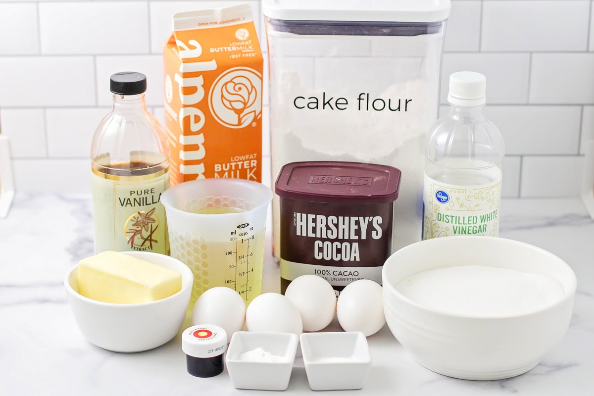 Cocoa, flour, and other ingredients on a kitchen counter.