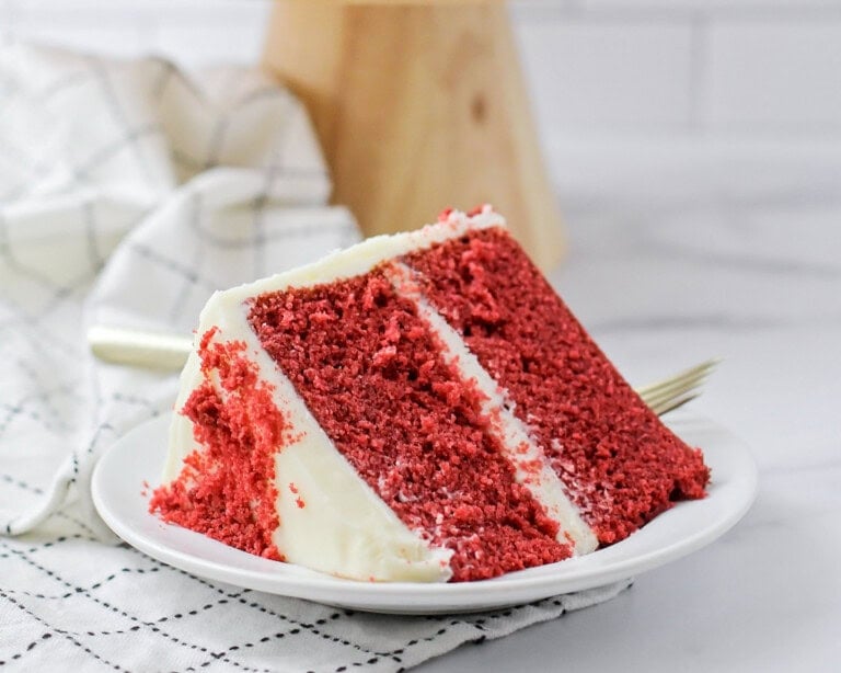 A slice of red velvet cake served on a plate.
