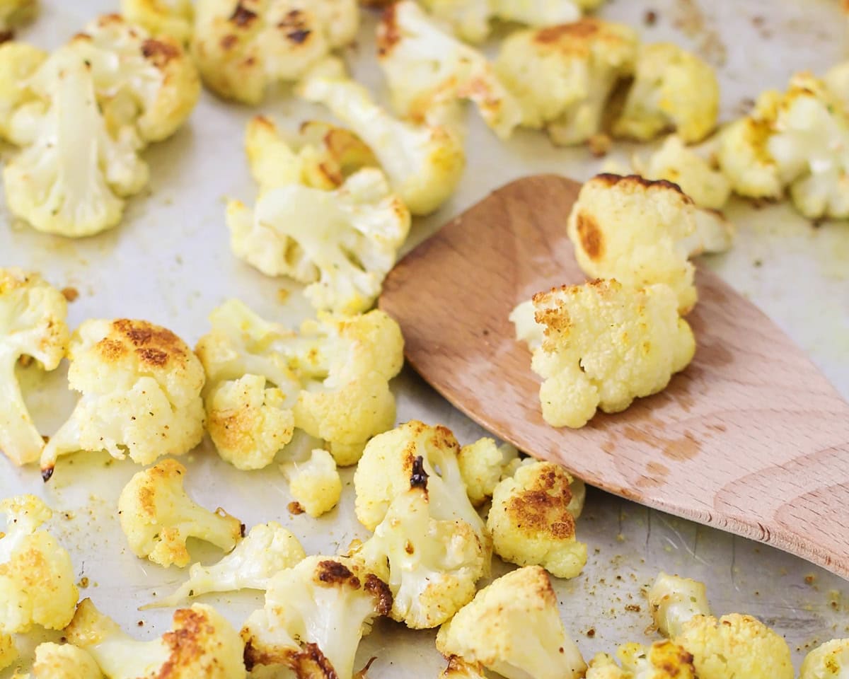 Roasted cauliflower on a baking sheet.