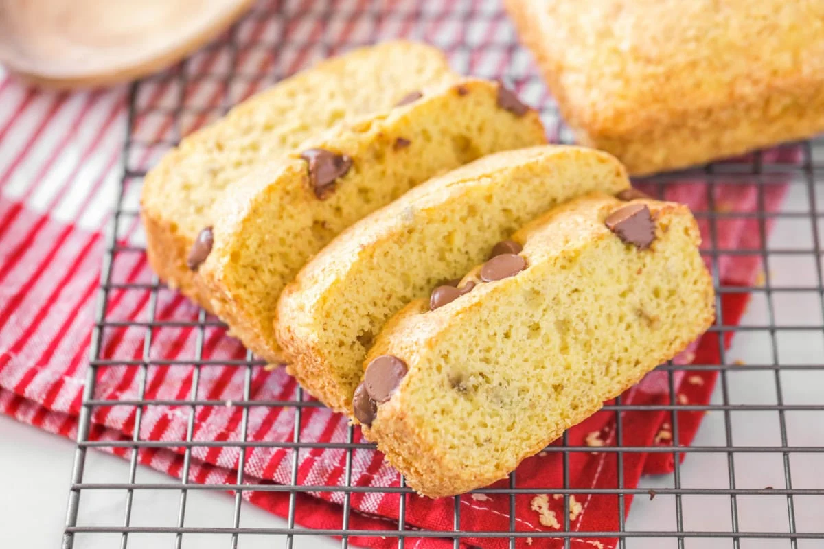 4 slices of 3 ingredient banana bread cooling on wire rack.