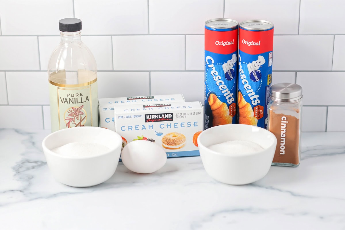 Pairing two dessert favorites in one, our churro cheesecake bars use a simple shortcut for a 30-minute twist on a Mexican treat! Crescent rolls, cream cheese, and other ingredients on a kitchen counter.