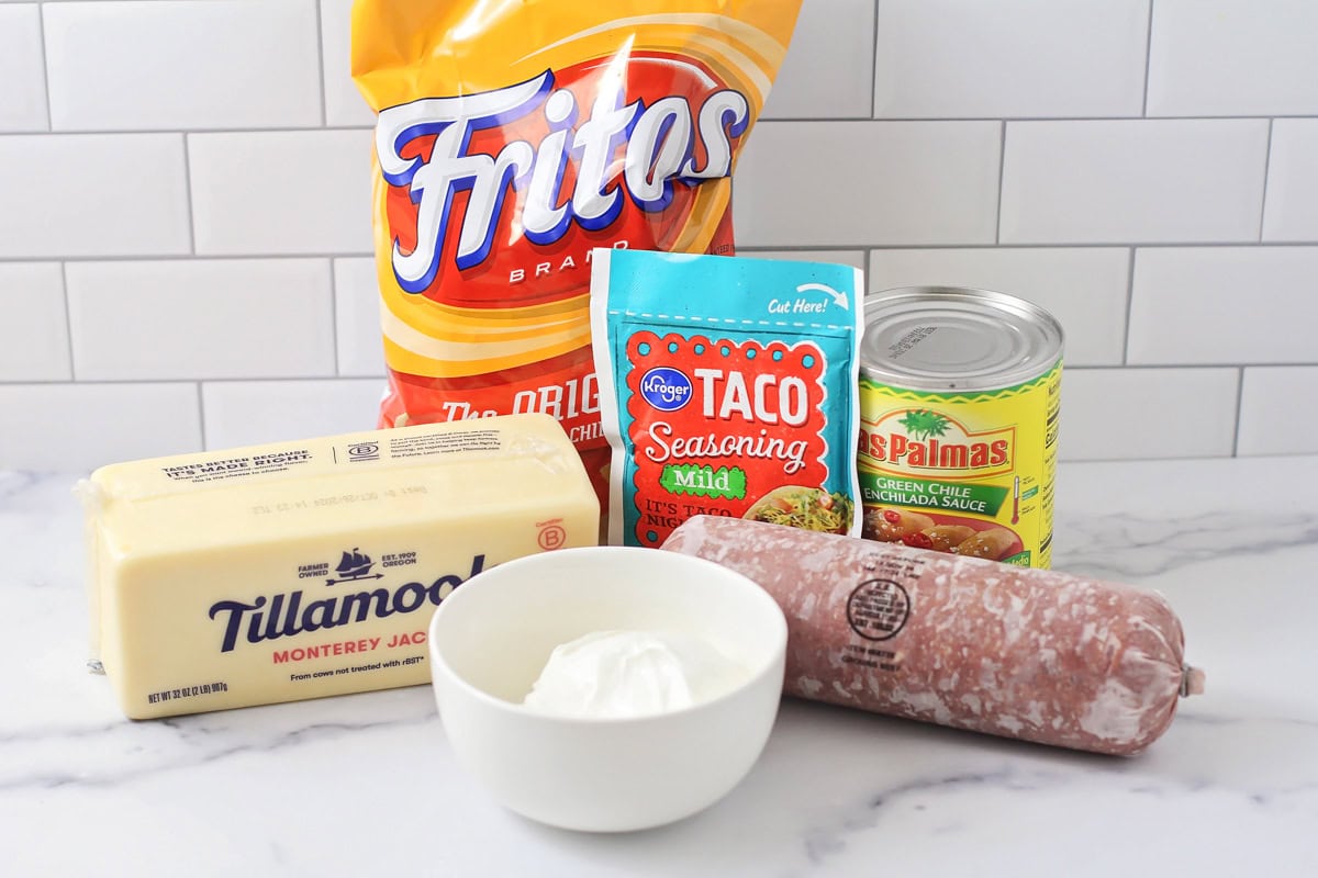 Frito pie ingredients on a kitchen counter.