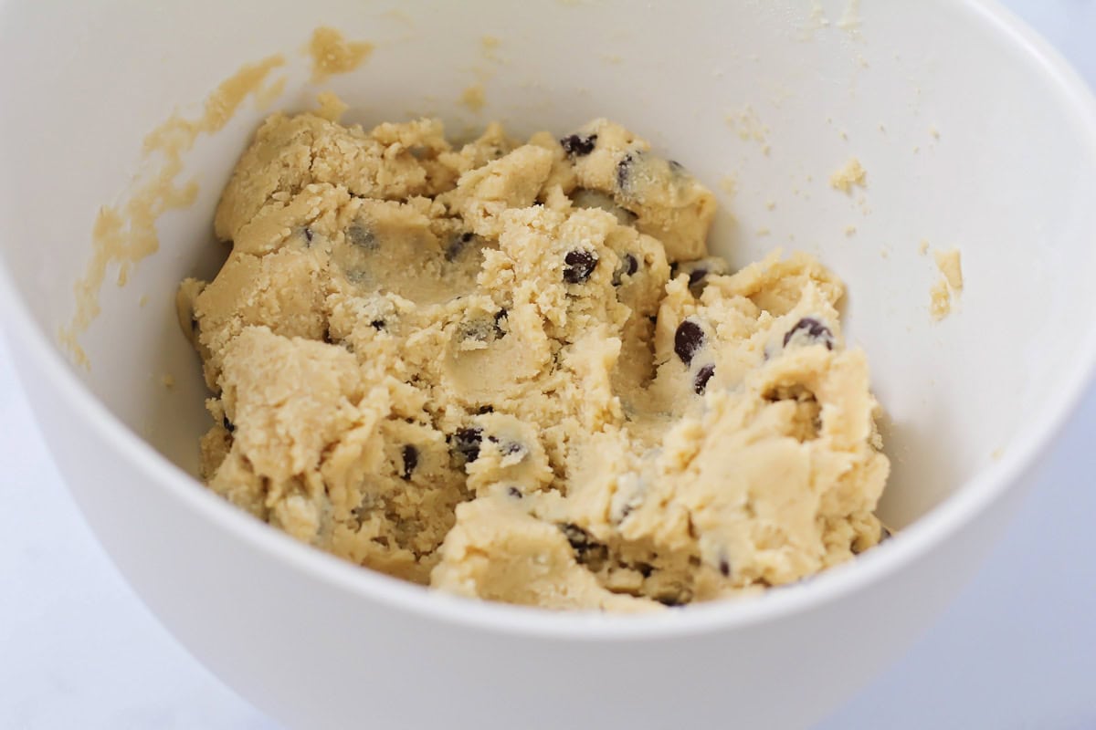 Cookie dough in a white bowl.