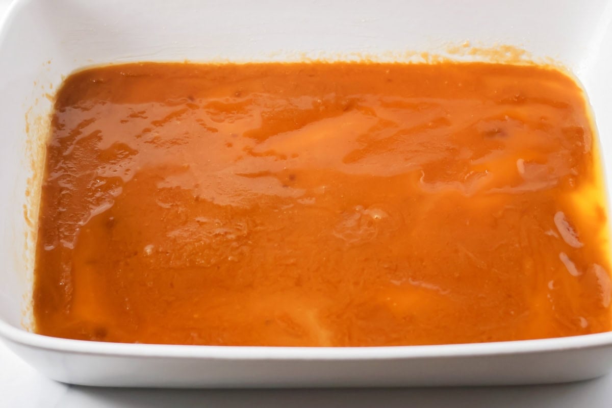 Brown sugar and melted butter in the bottom of a baking dish.
