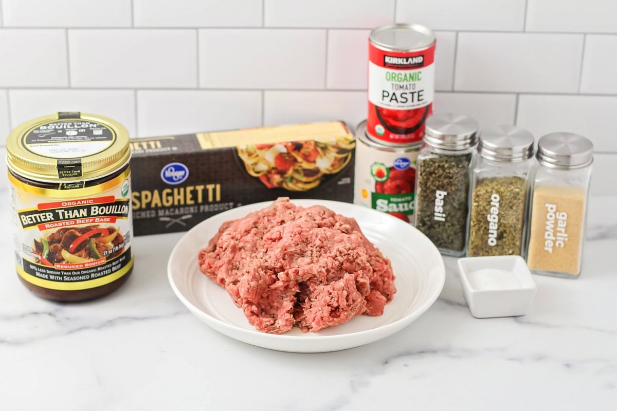 Ingredients for spaghetti recipe on counter.