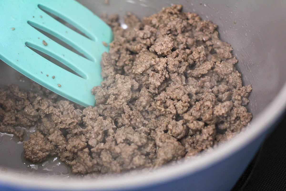 Browned hamburger beef in skillet for spaghetti recipe.