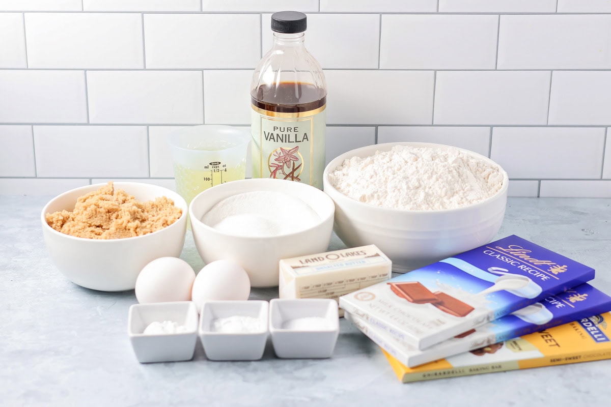 Ingredients for chocolate chunk cookies on a kitchen counter.