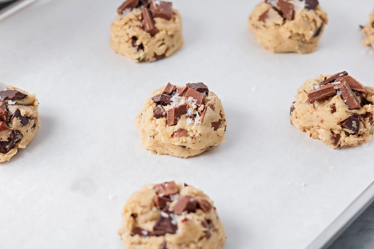 Sea salt sprinkled on top of cookie dough balls.