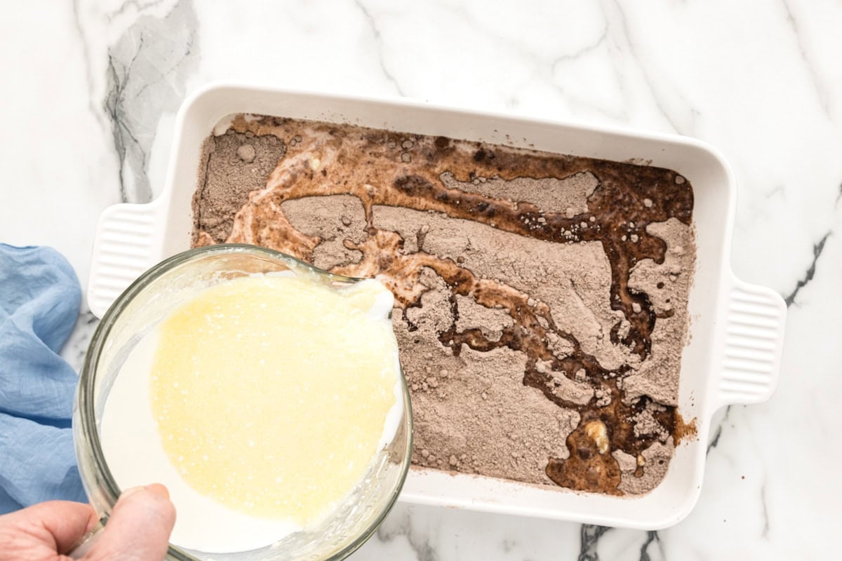 Adding milk and melted butter to the powdered mixes.
