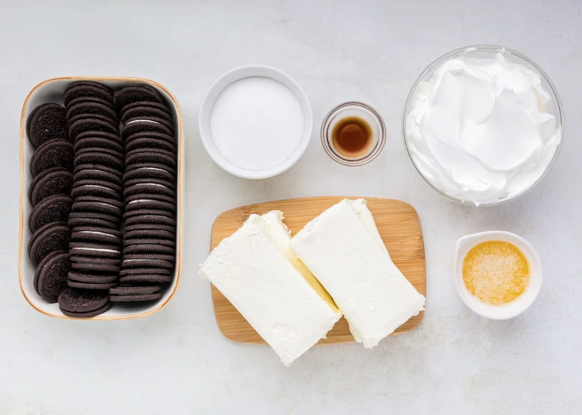 Ingredients for no bake oreo cheesecake on a kitchen counter.