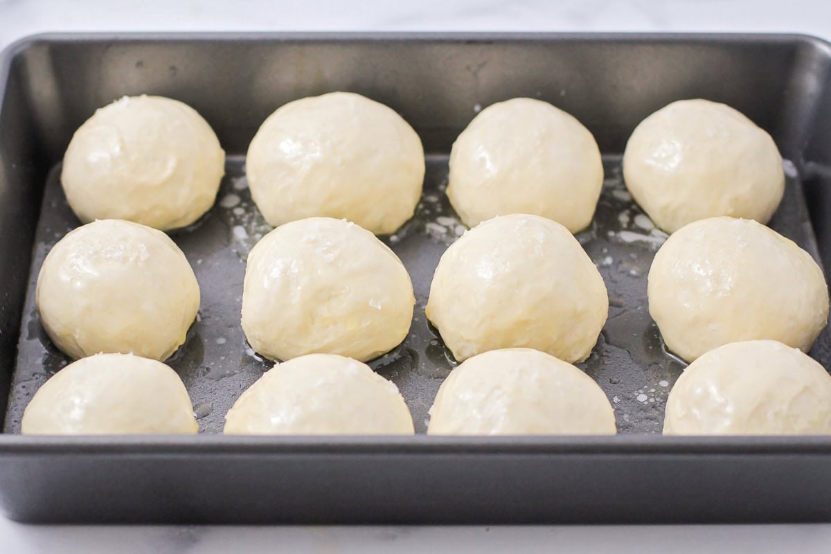 Dough balls brushed with melted butter and salt.