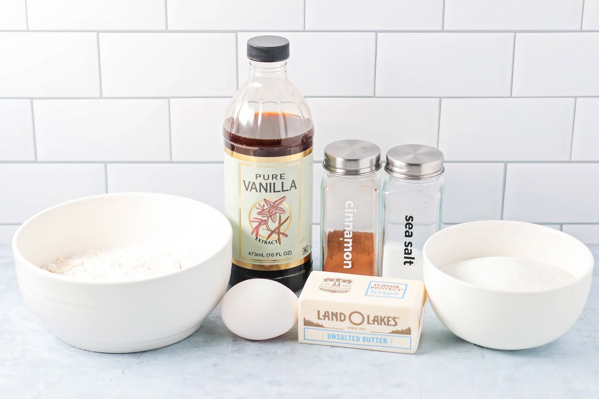Snickerdoodle Blondies are delicious bar versions of the famous cookie. They're soft and sweet and half the work! Ingredients for snickerdoodle blondies on a kitchen counter.