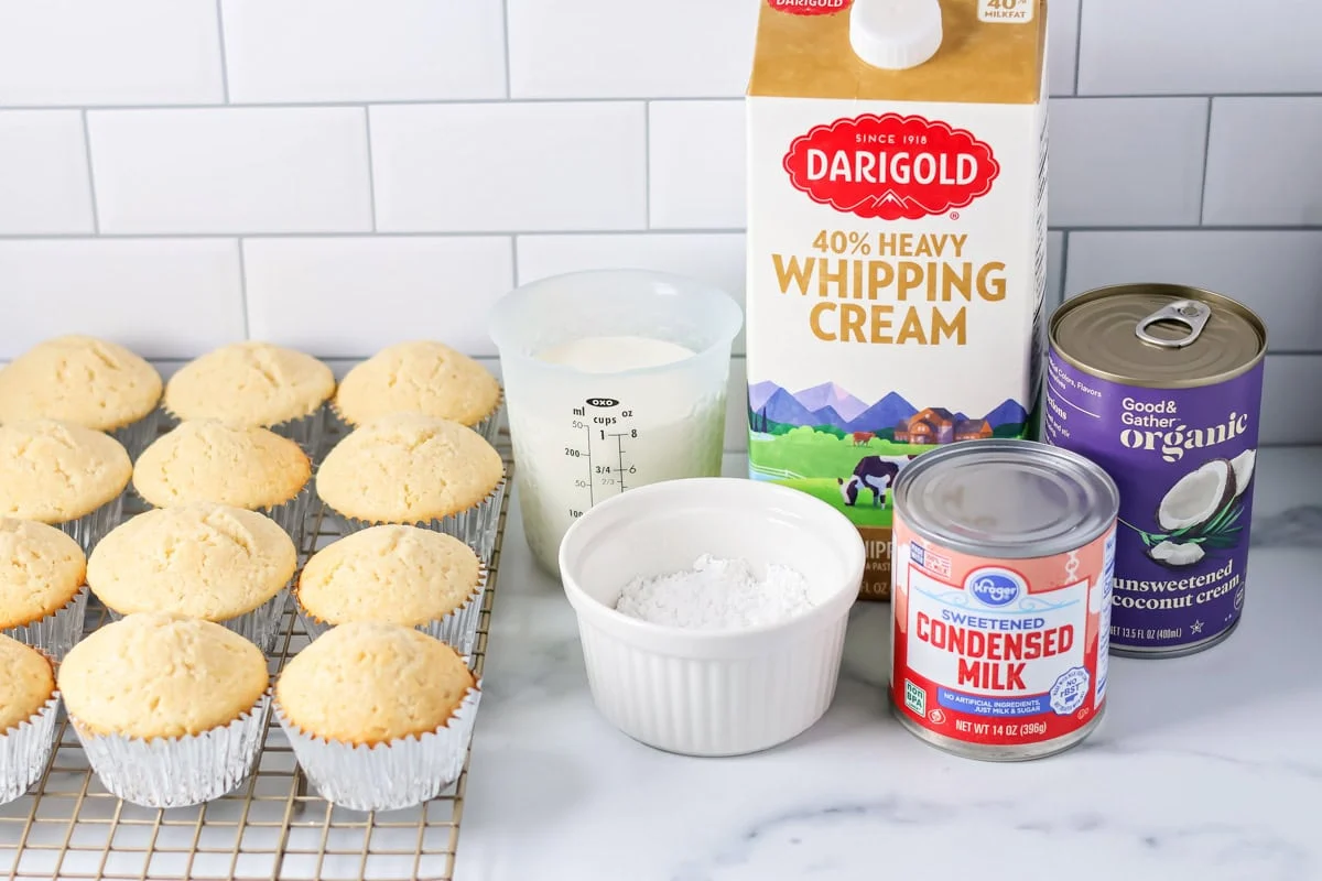 Tres leches cupcakes ingredients on a kitchen counter.