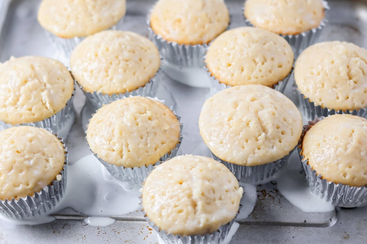 Soaked cupcakes on a kitchen couuntteer.