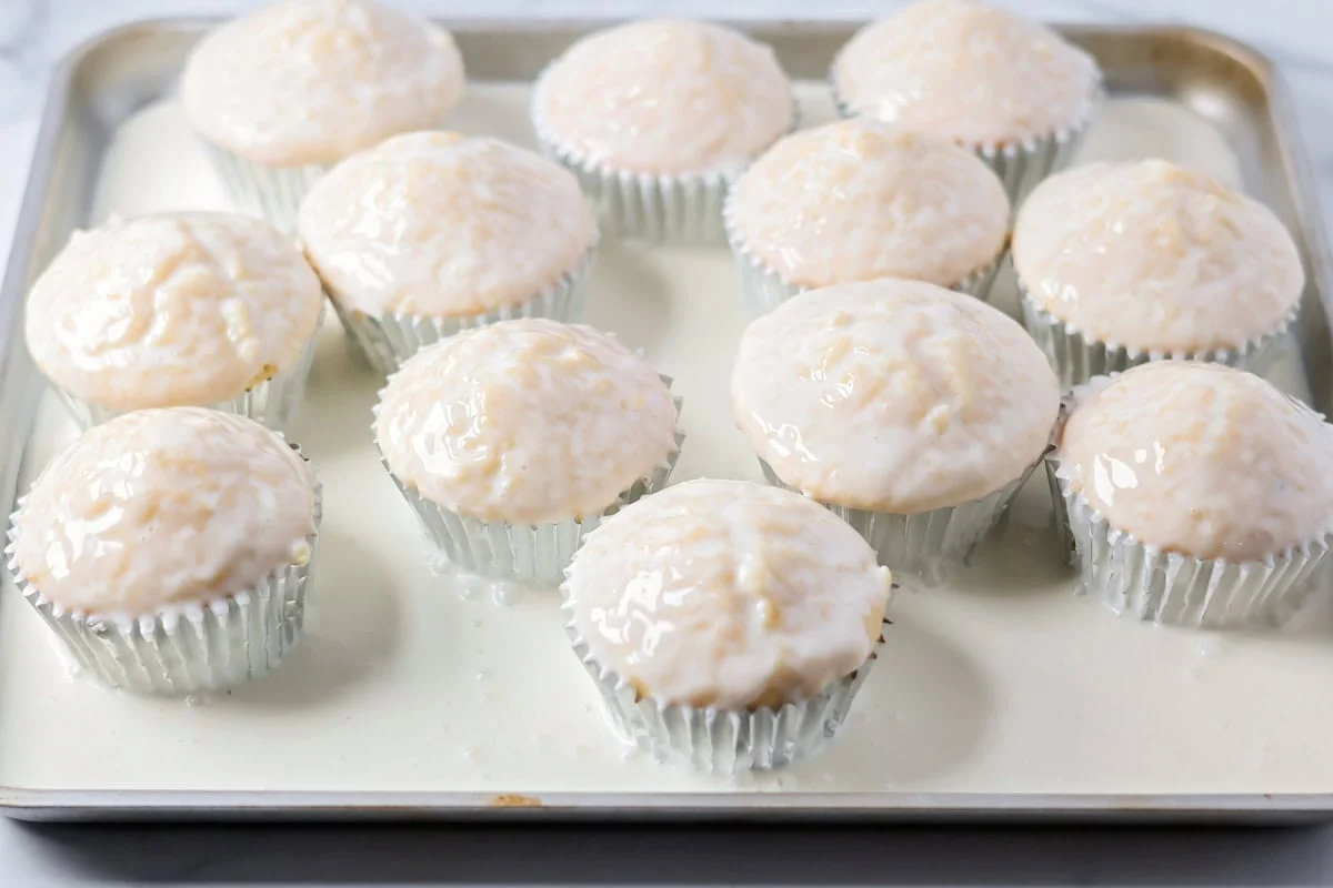 Soaked cupcakes in a baking dish.