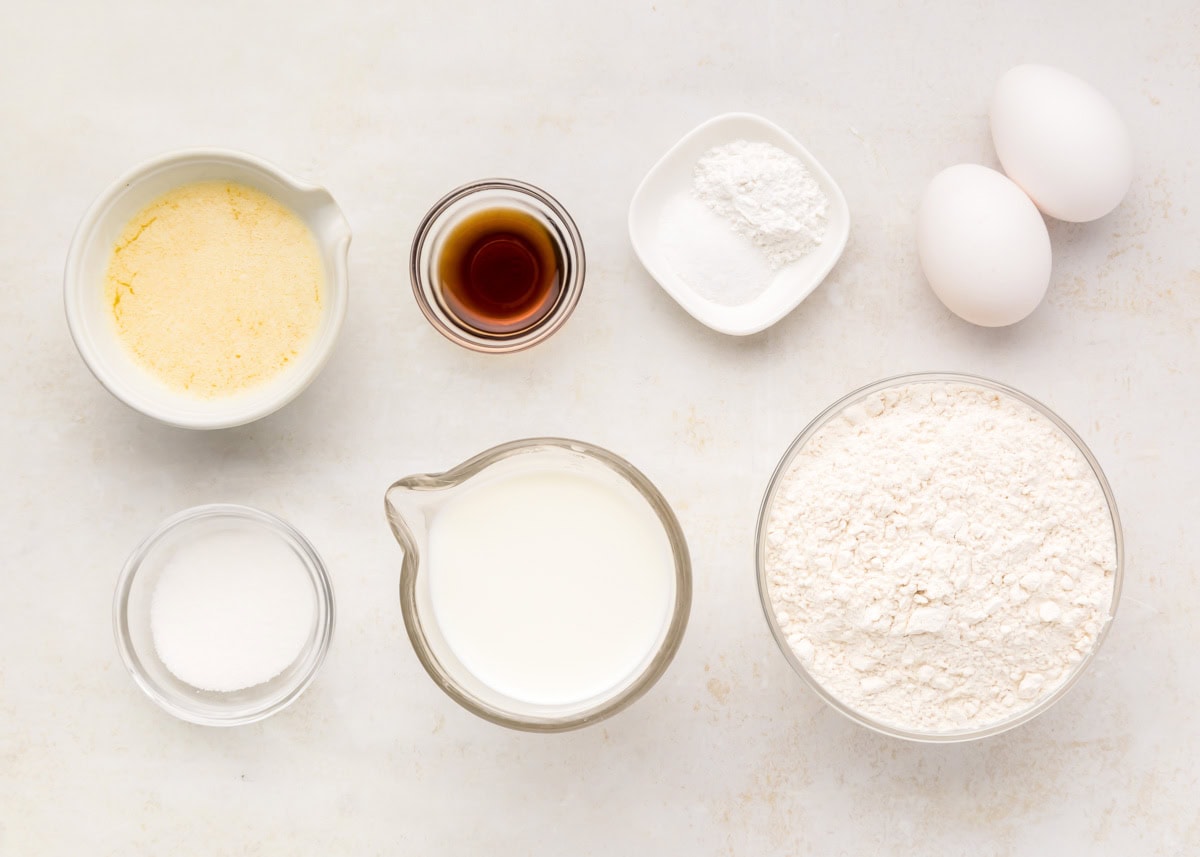 Waffle mix recipe ingredients measured on a kitchen counter.