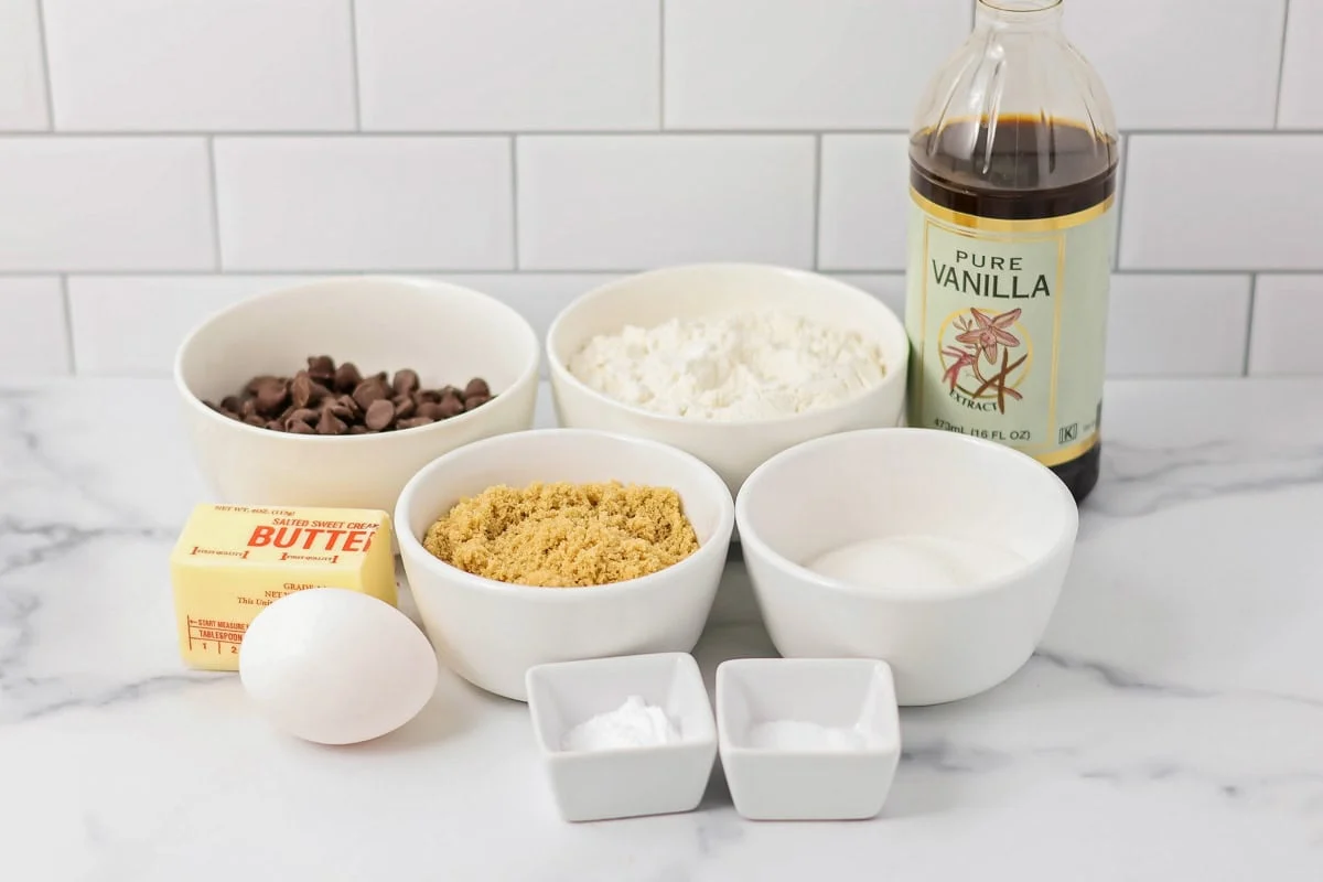 Brookies are the ultimate dessert mash-up, combining fudgy chewy brownies with gooey chocolate chip cookies for a truly irresistible treat! Brookies cookie dough ingredients on a kitchen counter.