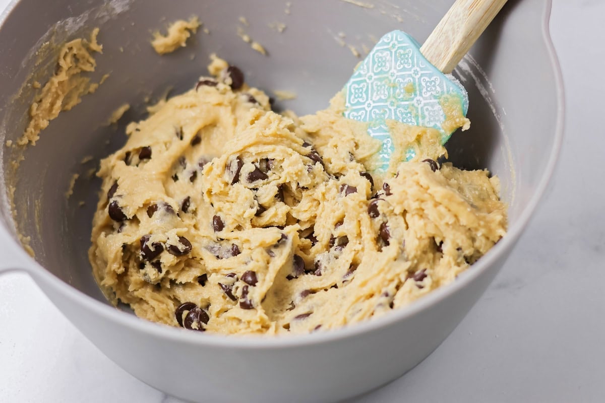 Chocolate chip cookie dough in a bowl.