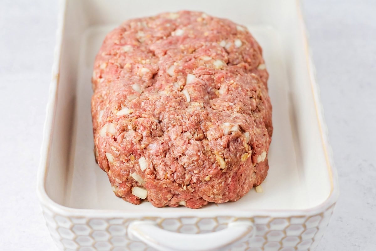 Easy meatloaf recipe shaped in baking dish.