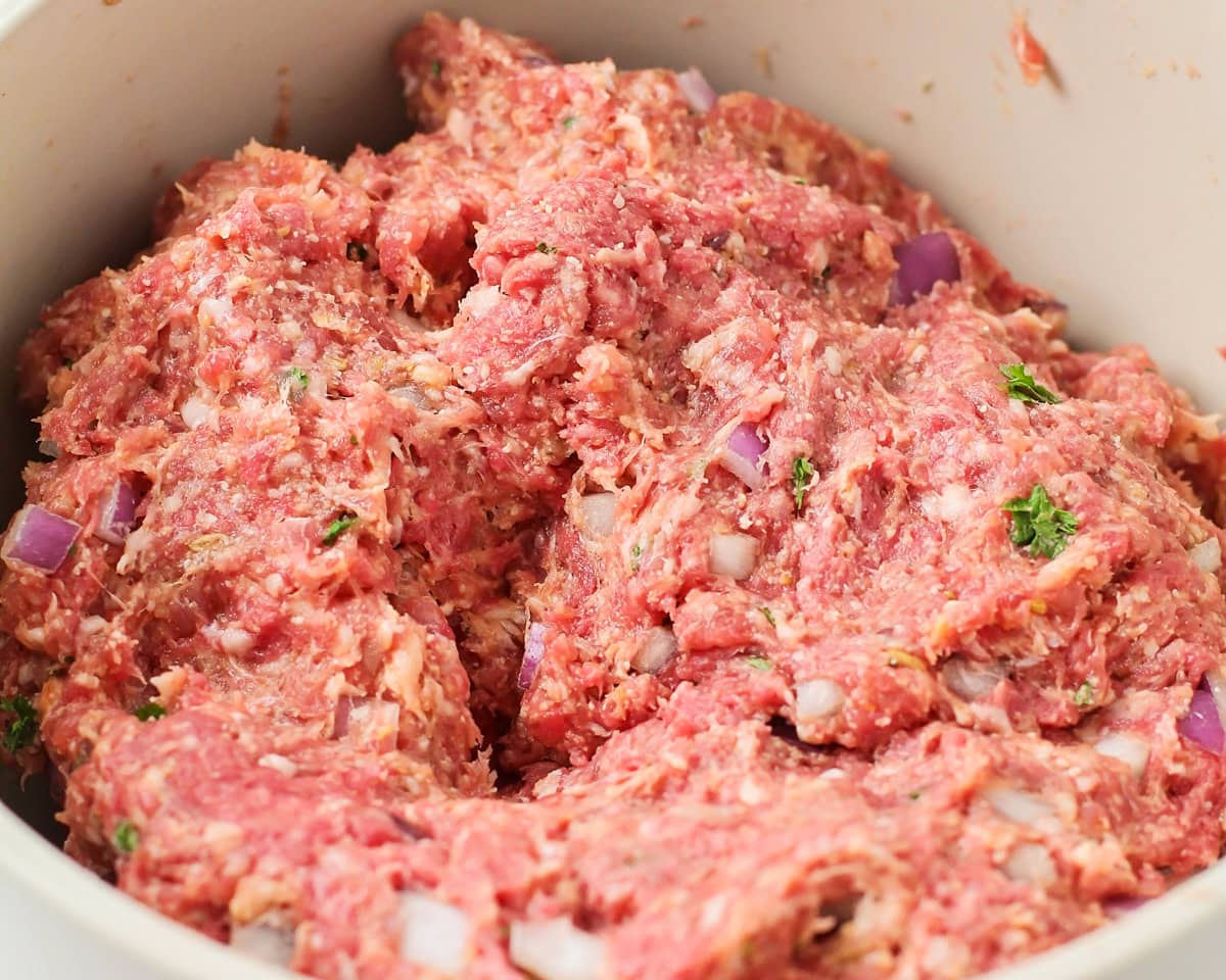 Seasoned ground beef in a bowl.