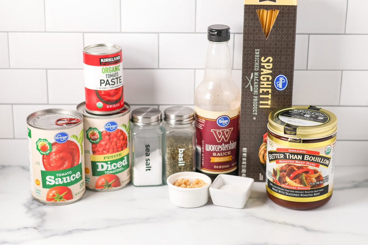 Spaghetti and meatballs is the ultimate, family-friendly comfort food, featuring easy homemade meatballs simmered in a rich tomato sauce! Ingredients for spaghetti and meatballs on a kitchen counter.