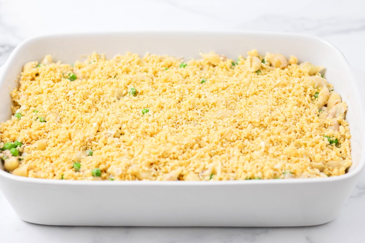 Tuna casserole topped with cracker crumbs and ready to bake.