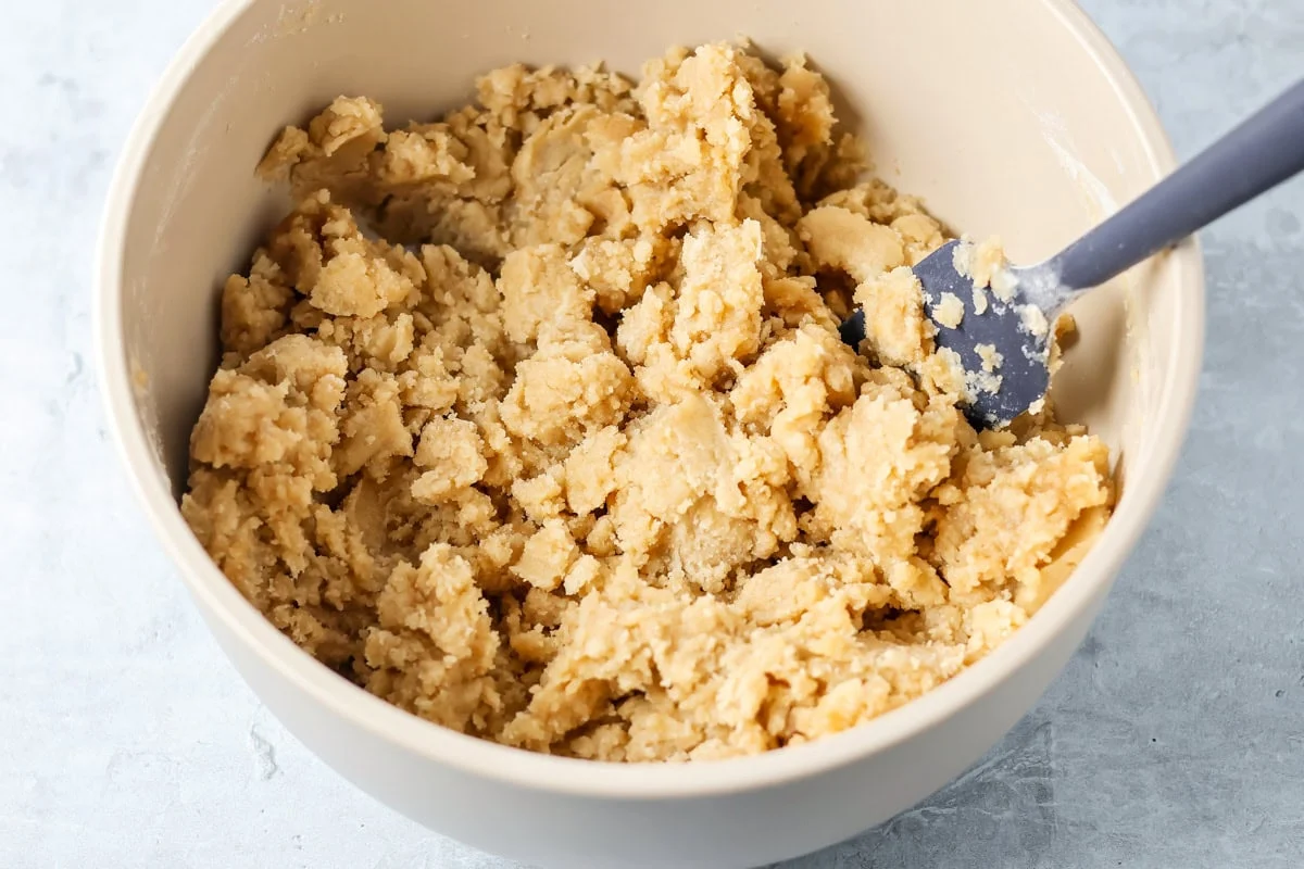 Shortbread curst in a mixing bowl.