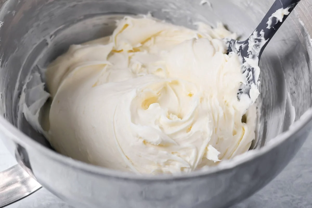 Cream cheese frosting mixed in a bowl.