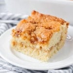 The best coffee cake recipe cut and served on a white plate.