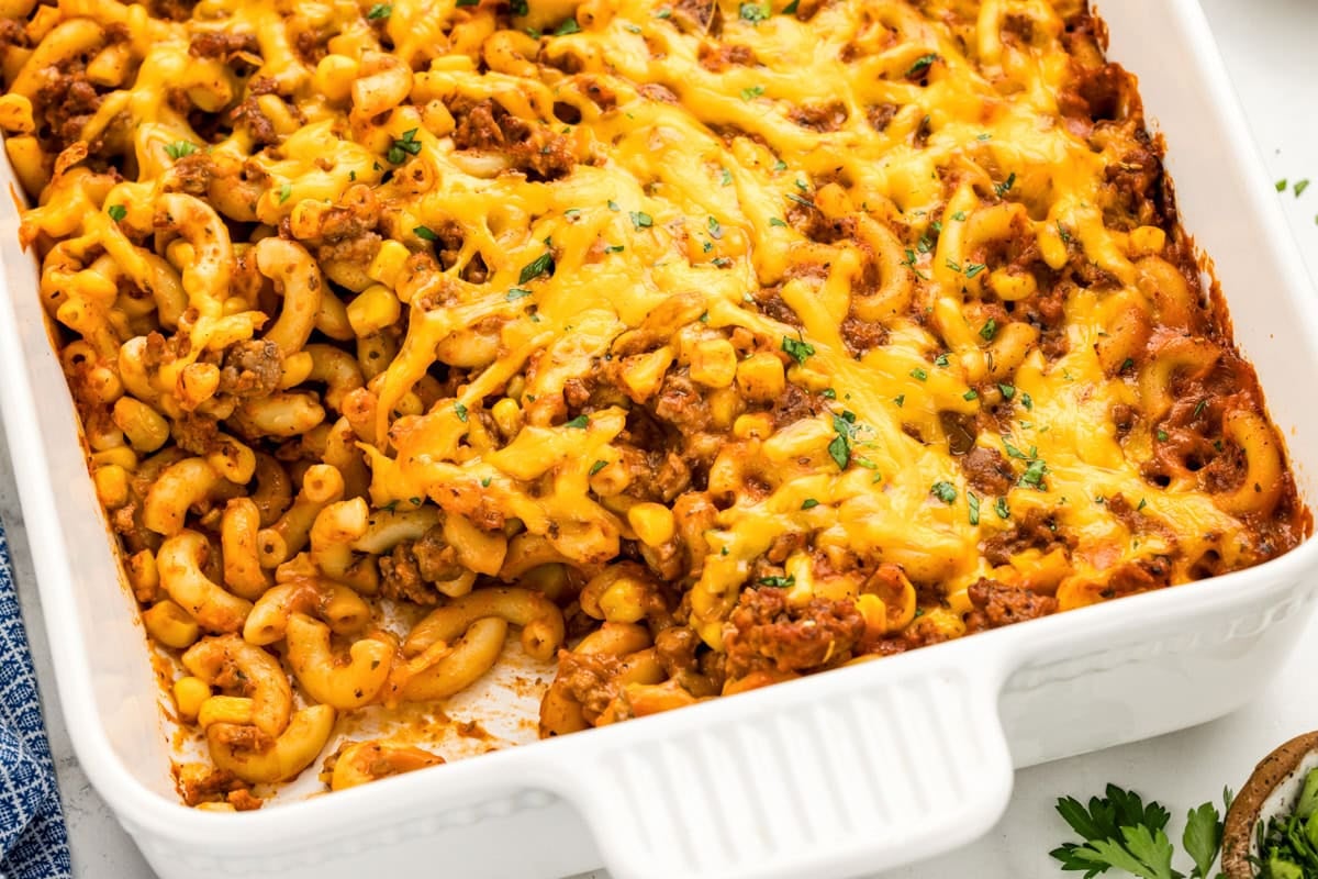 Hamburger casserole scooped from a baking dish.