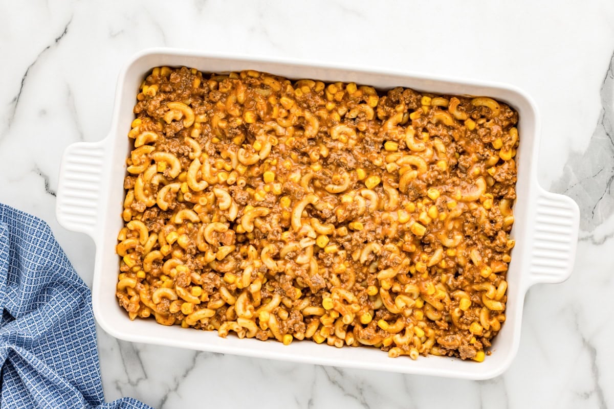 Hamburger casserole in a baking dish ready to bake.