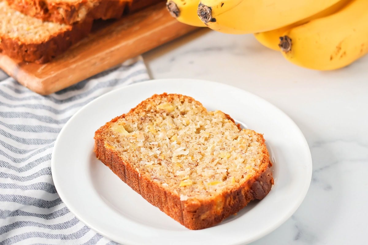 Slice of Hawaiian banana bread on a white plate.