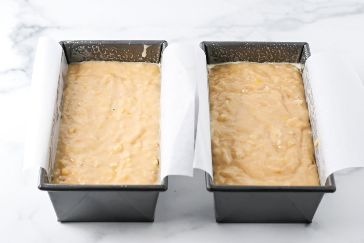 Batter in lined baking pans.