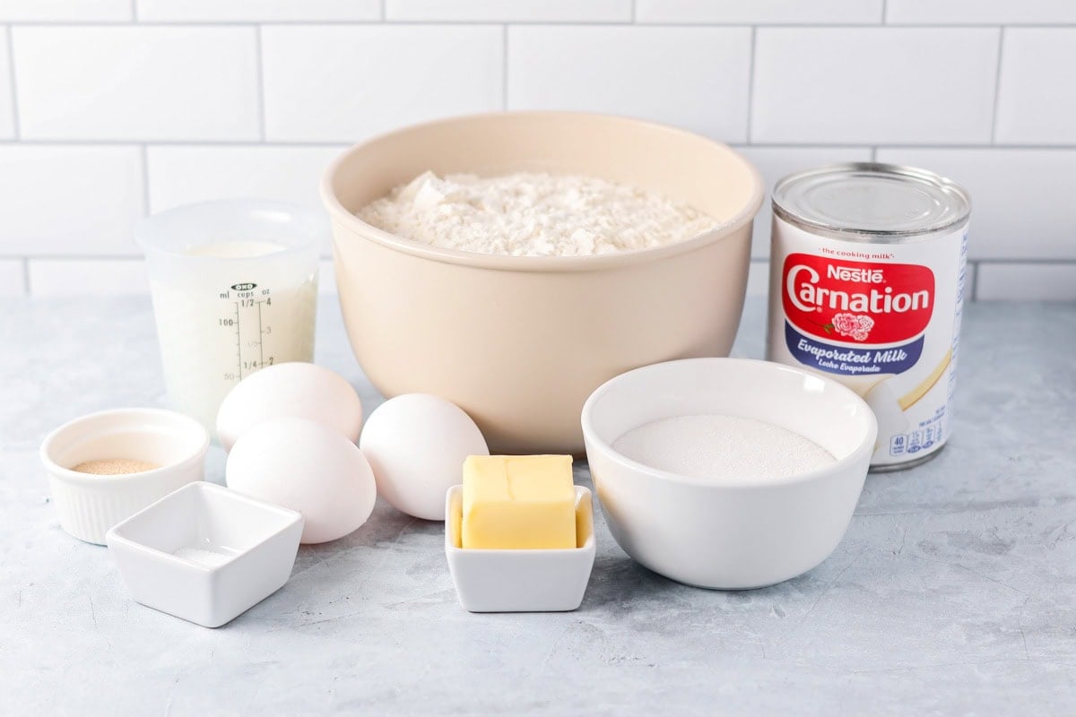 Ingredients for malasada recipe on a kitchen counter.